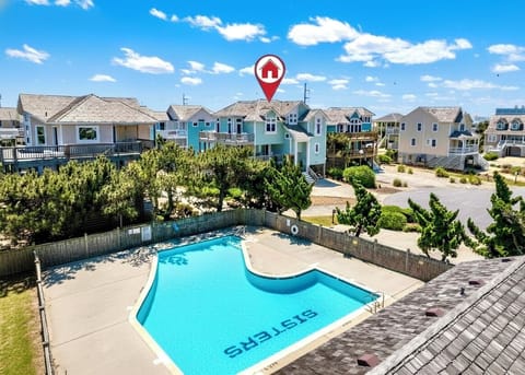 Dive into a vacation dream! This cozy home boasts a sparkling pool next door!