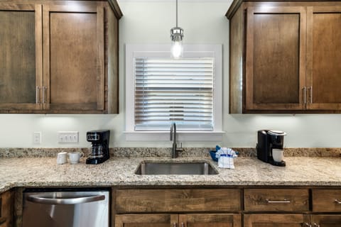 Kitchen - The kitchen features granite counter tops, stainless appliances, and custom cabinetry that is fully stocked with all items needed for meal prepping during your stay.