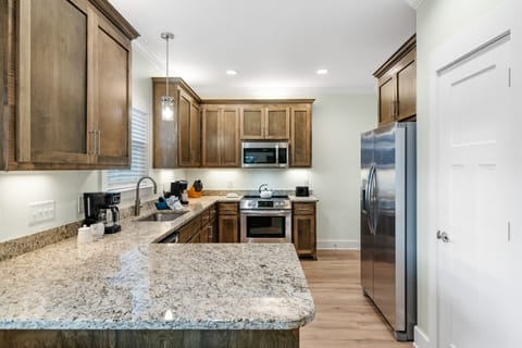 Kitchen - The large kitchen offers both small and large appliances. An auto drip coffee maker as well as a single k-cup maker is provided for your convenience.