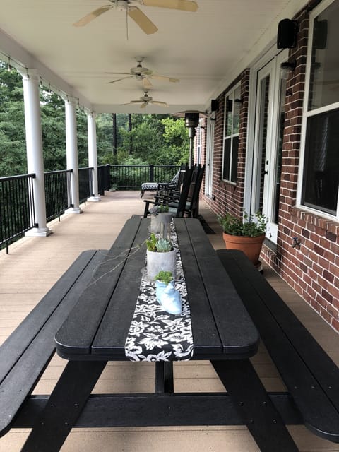 Top Deck --- table, rocking chairs and chaise lounges. 