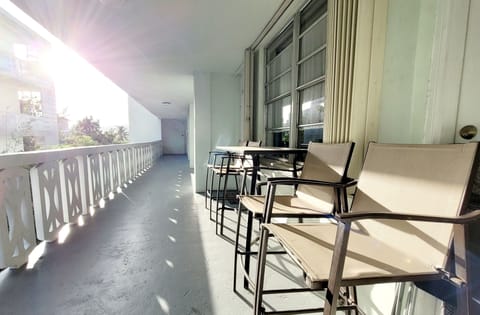 Semi private balcony with table and chairs