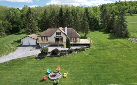 Brand new wrap around porch w/ hot tub, outdoor firepit w Adirondack chairs. 