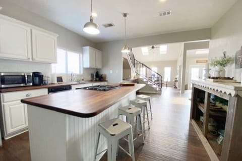 Kitchen is stocked with many cooking, baking and serving items for your family