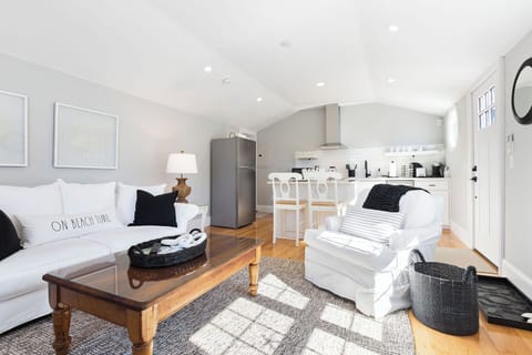 Beautiful open space living and dining area with nautical ascents and A/C. 