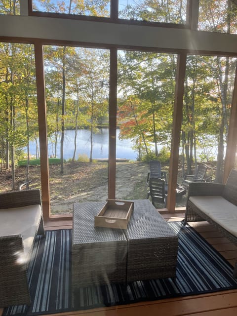Screened in porch, fire pit in backyard