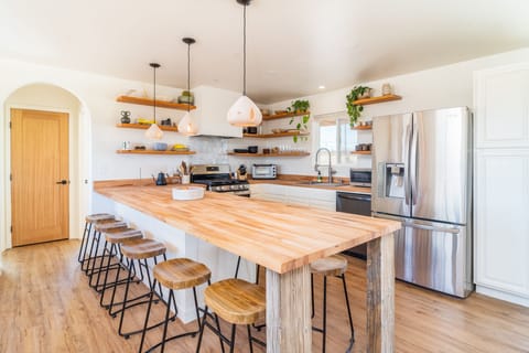 Open floor plan kitchen with 8 barstools for big dinner parties!