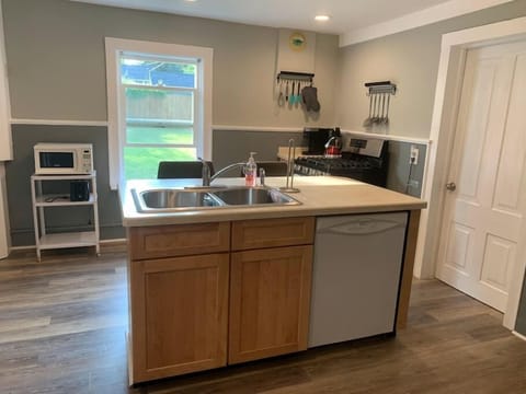 Kitchen: Range, Fridge, dishwasher, microwave, Keurig, teapot, dishes and silverware (2)