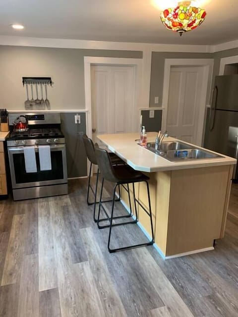 Kitchen: Range, Fridge, dishwasher, microwave, Keurig, teapot, dishes and silverware (1)