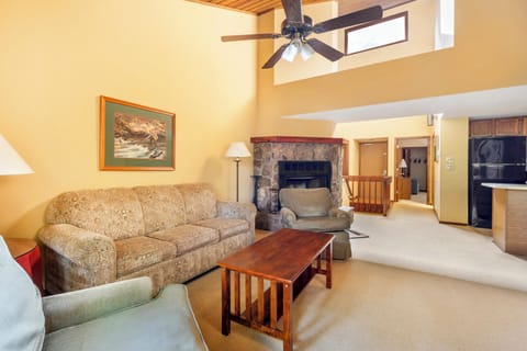 Stretch out together in the open living area with fireplace glow.