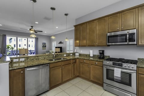 Looking into the living/dining space. Four bar stools for more seating.