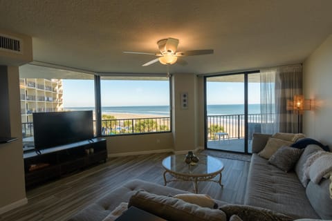 Huge picture windows and sliders provide ocean views.
