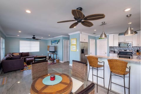 Dining table, kitchen bar and living room