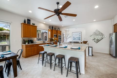 The island has additional dining seating.