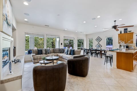 The open concept living room and dining room makes gathering with your group easy.