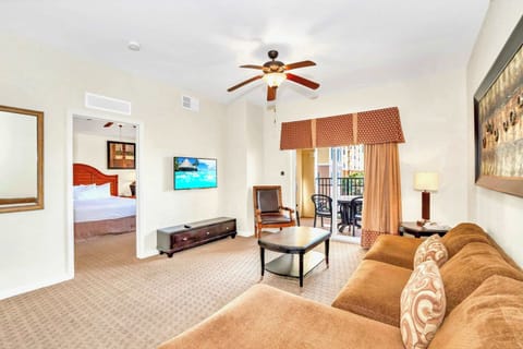 Spacious Living Area Featuring A Smart TV And Sliding Doors To The Balcony