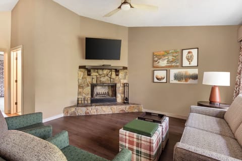 Unwind on plush seating for movie nights by the fireplace.
