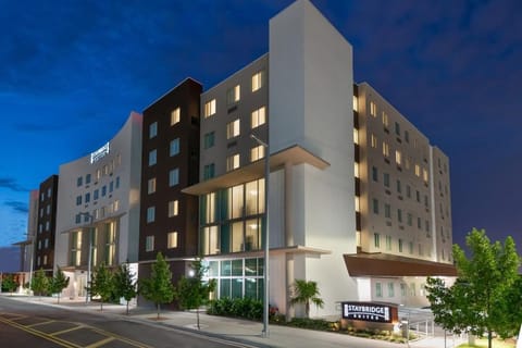 Arrive confidently to a modern, well-lit exterior at night.