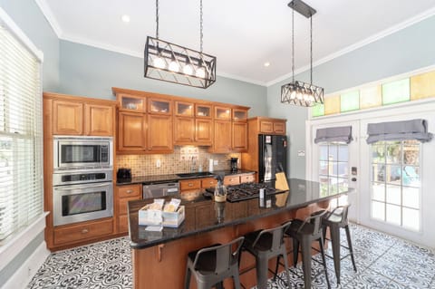 Full kitchen with two ovens, gas stove, microwave, coffee maker, refrigerator