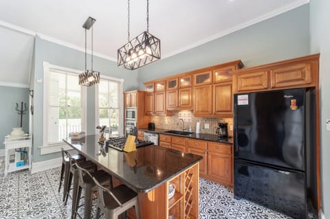 Full kitchen with two ovens, gas stove, microwave, coffee maker, refrigerator