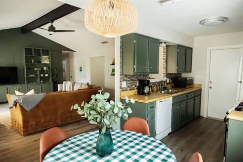 Galley kitchen opens into the living room. Our design is both bohemian and eclectic and our guests love how inviting it is