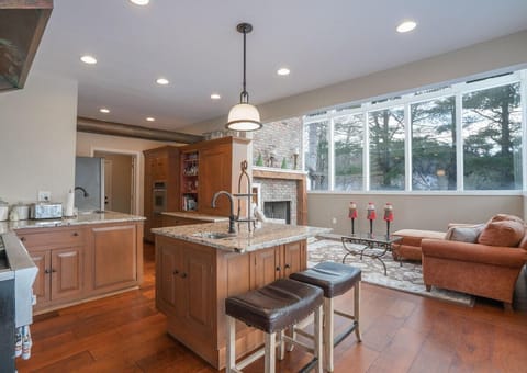 Open layout kitchen with sun room