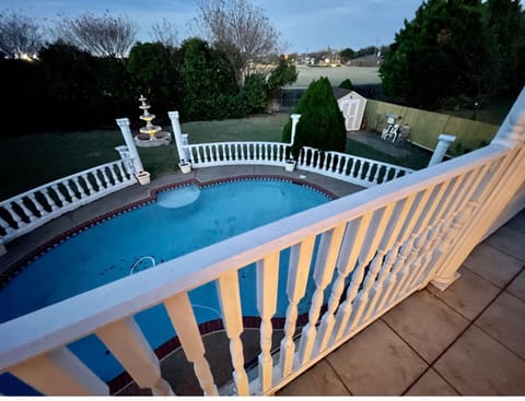 Pool, and balcony with a great view to the patio, pool and park.