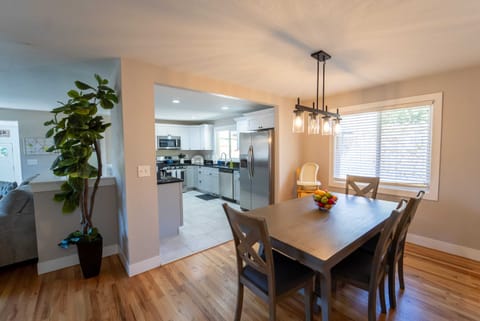 The table has six seats and there are folding chairs as well.