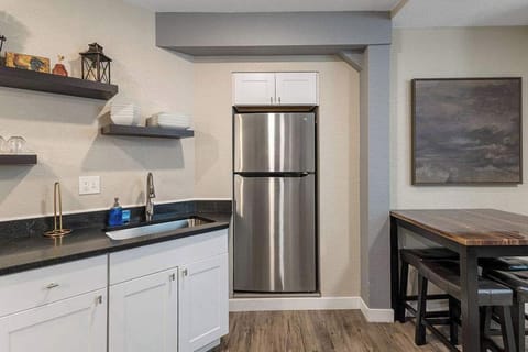 The kitchen also has a refrigerator/freezer.