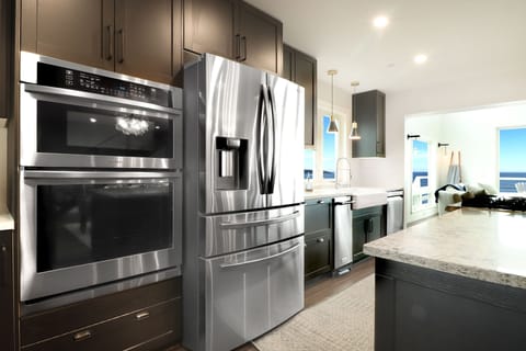 Kitchen refrigerator and oven