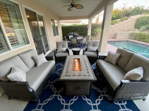 Relax around the fire pit in gliders and swivel chairs. 