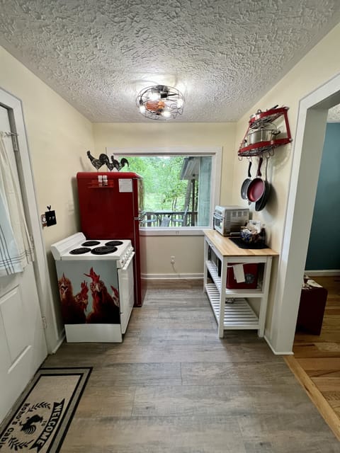 New retro fridge, toaster oven/air fryer, microwave, and countertop ice maker.