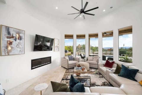 A spacious living room upstairs to watch your favorite shows, or just sit by the fire and enjoy the views.