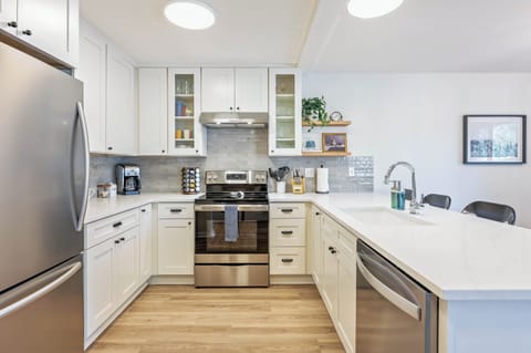 Fully equipped kitchen with stainless steel appliances and Quartz countertops