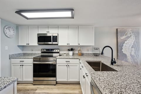 Kitchen with granite countertops and Samsung appliances.  