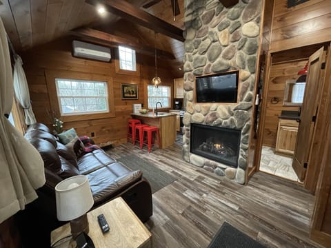 Cathedral ceilings, fireplace, smart tv, spacious open concept floor plan!