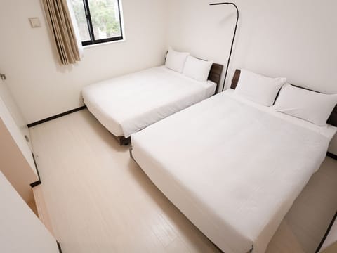 ・[2nd floor bedroom] A bright room with two double beds.