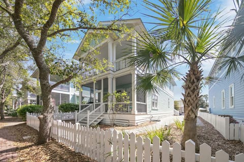 Out the screened porch a pathway leads to a pool, ball courts and playground.