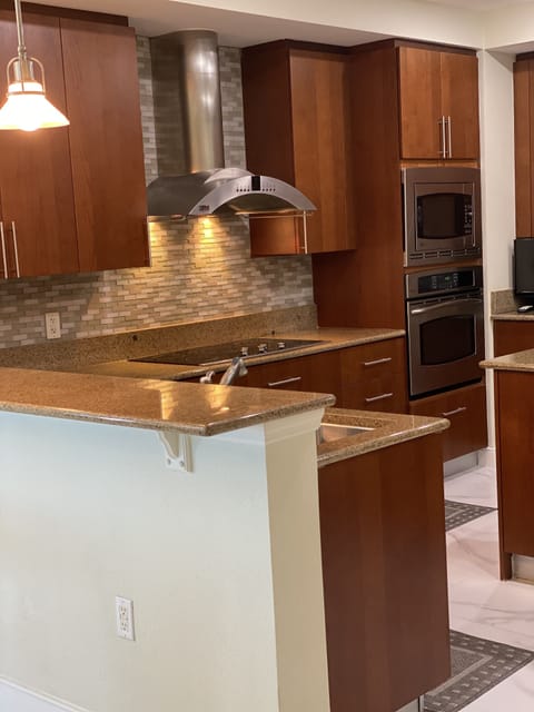 Custom cabinetry and granite, with marble floors throughout 