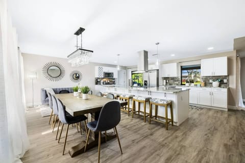 Welcome to Gulf Coast Cabana—a bright, open kitchen and dining area with a fully stocked setup and cozy coffee bar, perfect for meals, conversation, and relaxed mornings together.
