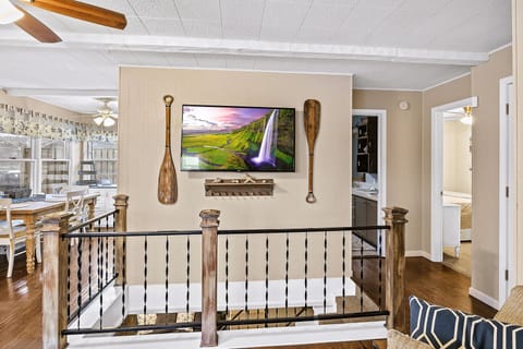 The TV was hung over the stairs so 8-9 guests can view it!!