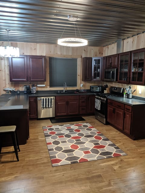 Large kitchen with plenty appliances to make stay comfortable.