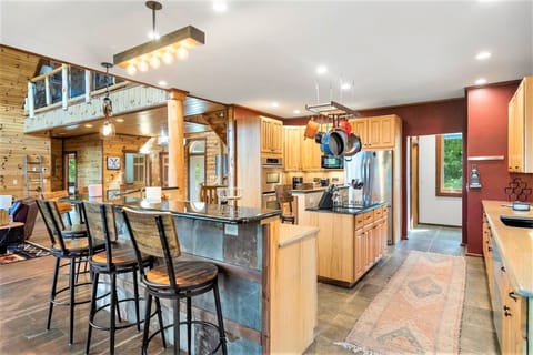 Huge open concept kitchen with lots of counter space for big meals for the group