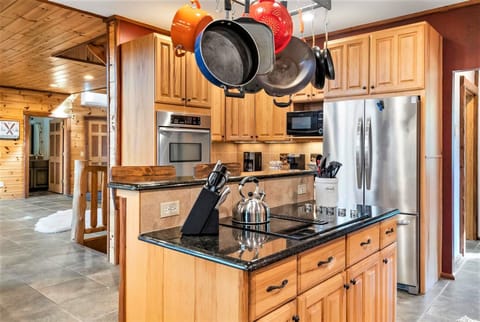 Pots/pans in a huge open concept kitchen that has room for everyone during meals