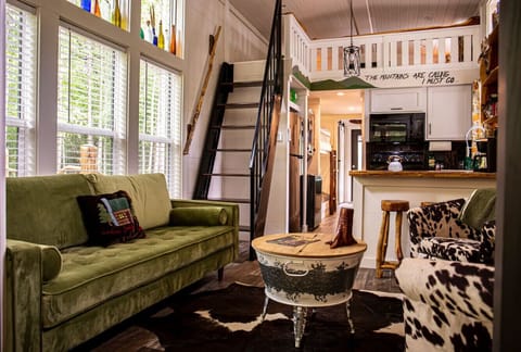 Bright and cozy living room stocked with games (monopoly, monopoly deal, Yahtzee, uno, and cards) and TV with lots of DVDs for all ages as well as free access to YouTube TV.