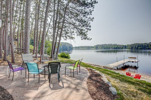 stamped concrete patio, stone fire pit, dock, sandy beach