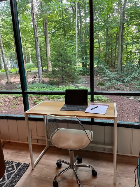 WFH / work from "home" folding desk set up in front window