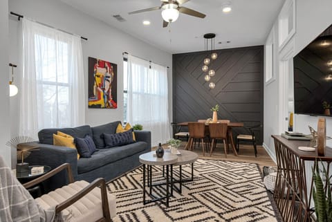 Spacious living room with Queen pullout couch, dining table with seating for 6, HD TV with YouTube TV for cable and all the apps you could want plus a walkout private patio with seating for 2.