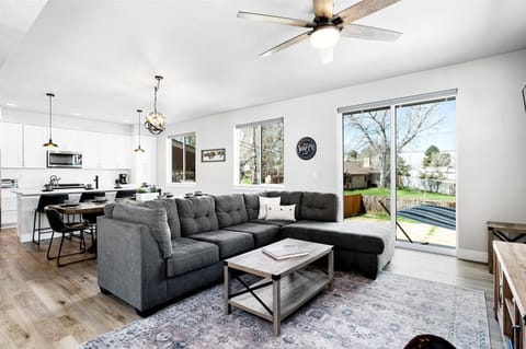 - Gather in this open concept living room with plush sectional and backyard views
