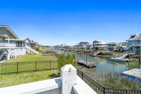 fenced yard on canal with private gazebo