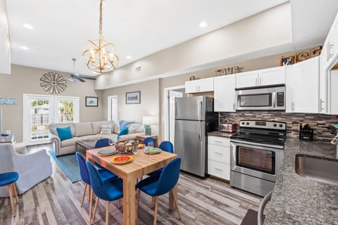 Fully Stocked Kitchen and Dining Area